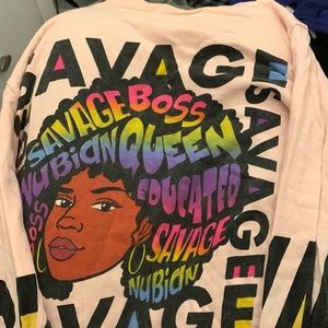This shirt is pink with words on it as a black girl